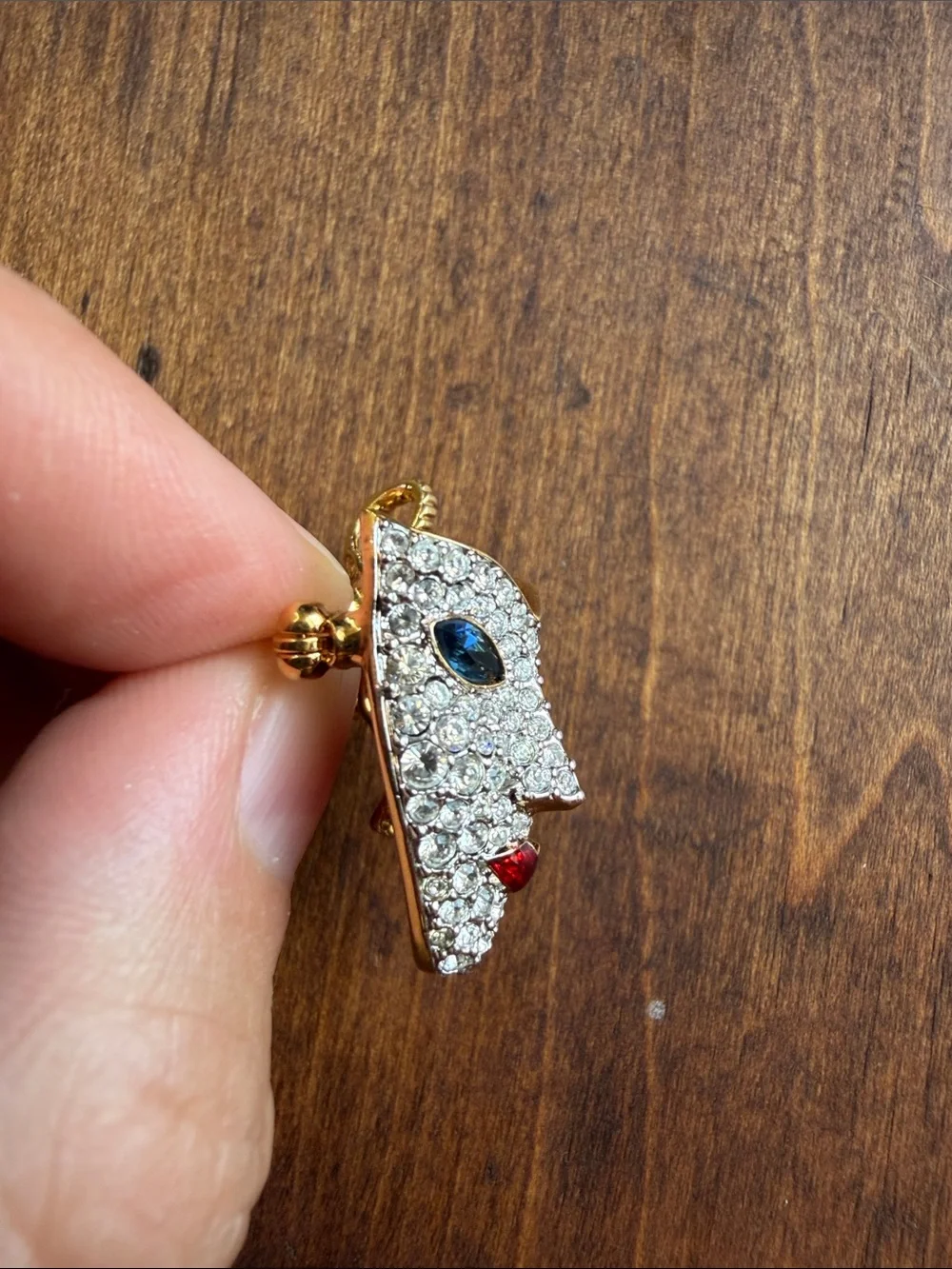vintage 1990s Swarovski masquerade mask brooch features a pave-set crystal face